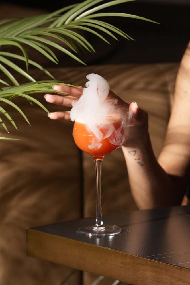 Smoky orange spritz served over dry ice