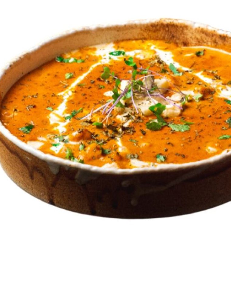 Creamy vegetarian curry drizzled with cream