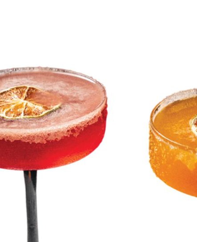 Two coupe cocktails rimmed with sugar