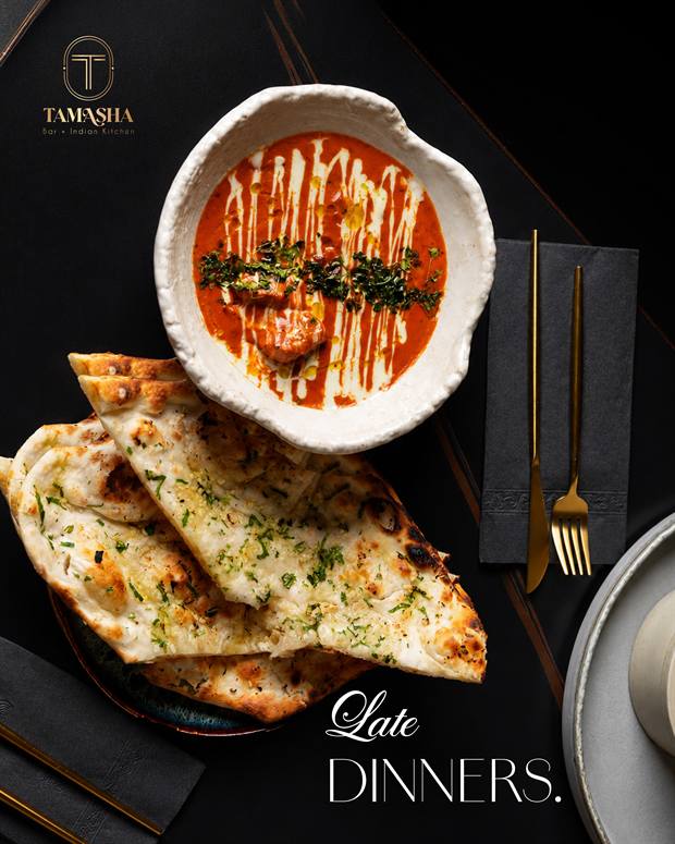 Butter chicken with garlic naan, photographed from above