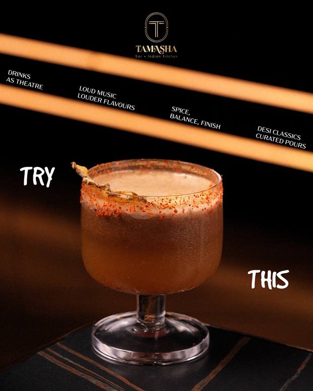 A signature Tamasha cocktail served in a coupe glass